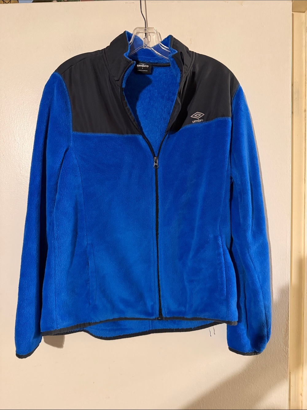Umbro soft fleece blue/black jacket. Zip closure. Front pockets